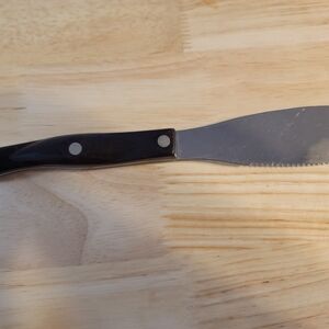 Black Cutco Handled Serrated Spatula Knife